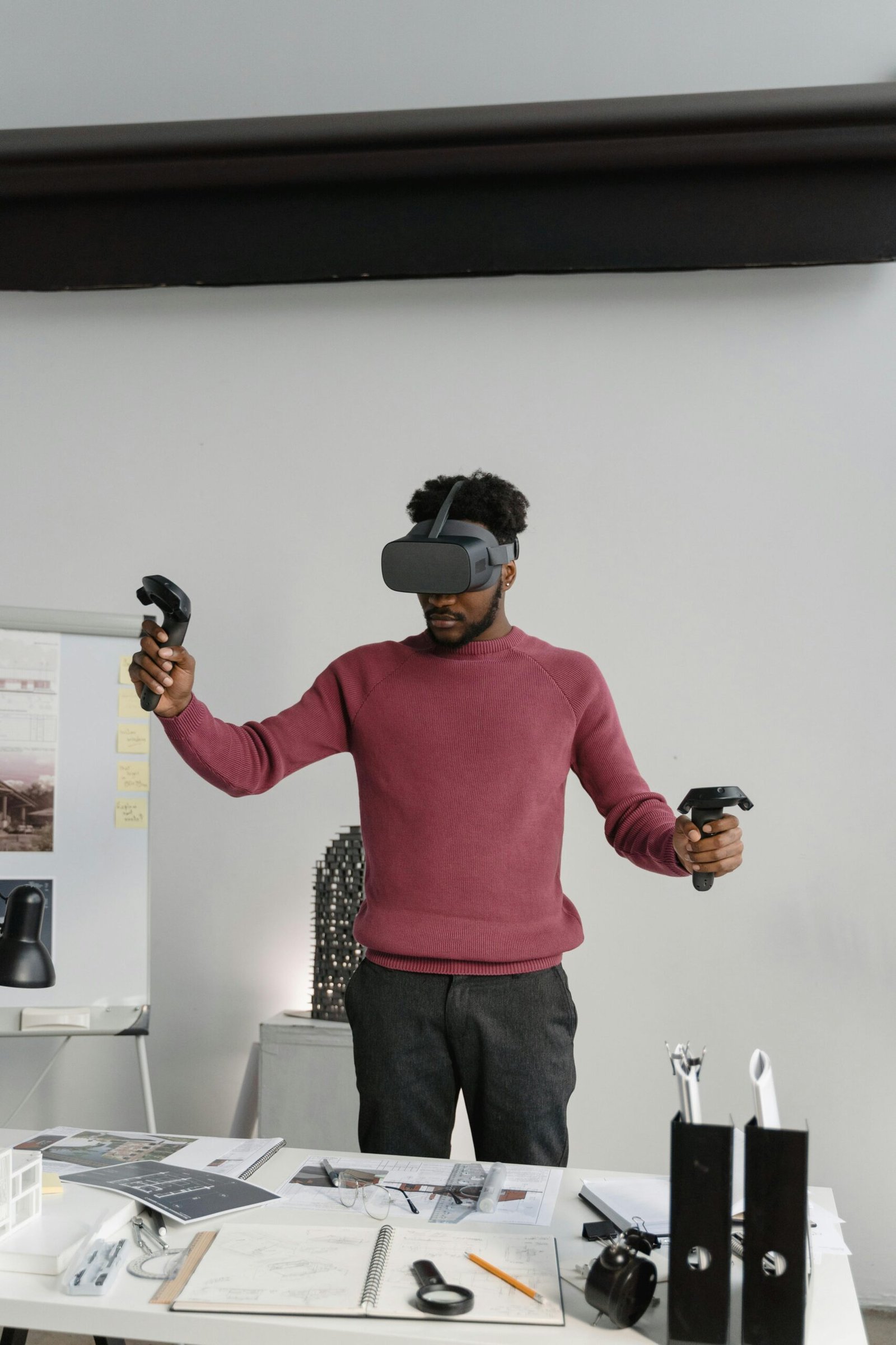 An architect using VR technology in an office setting to design and visualize projects.